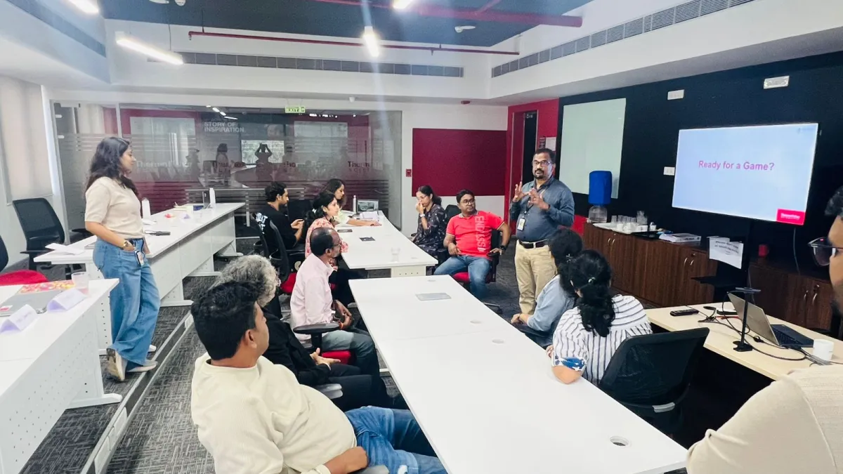 Sabu Thomas facilitating a leadership workshop with a group of managers